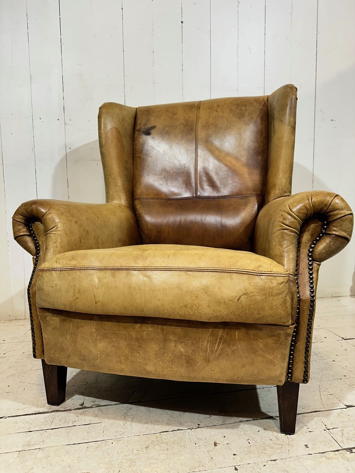 photo buy Vintage Hotel Lounge Wingback Armchair In A Distressed Aniline Leather