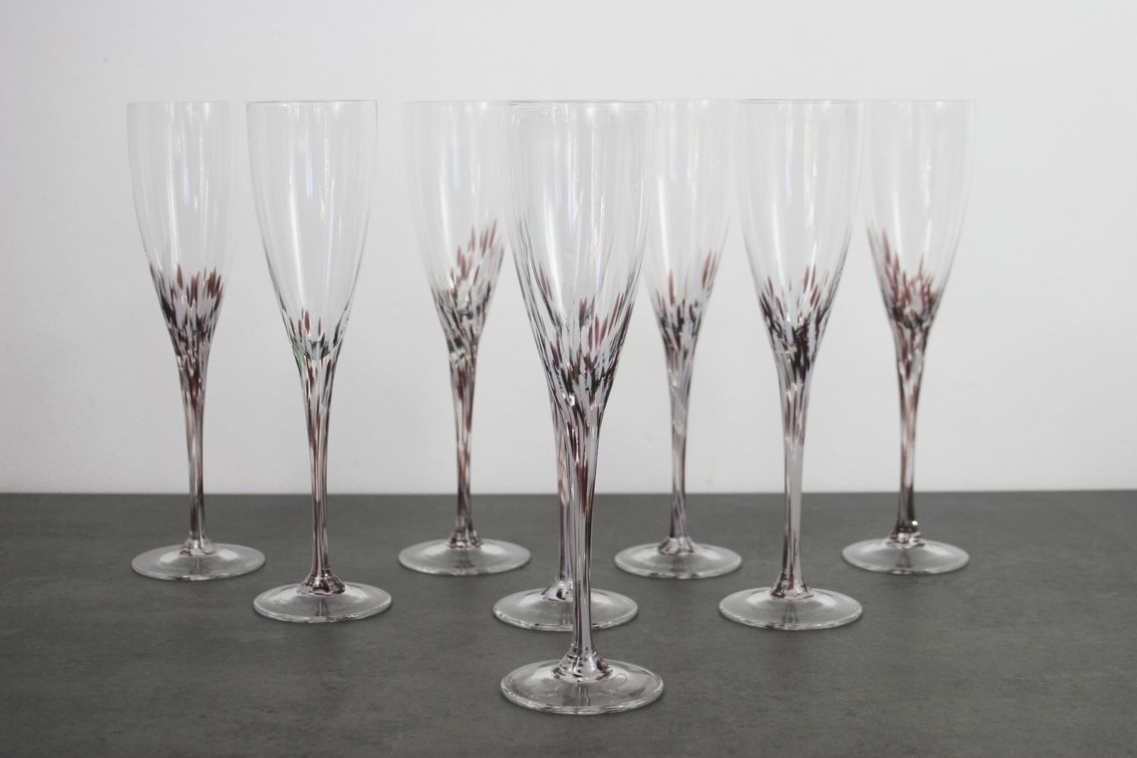 A Set Of Splatter Glass Champagne Flutes