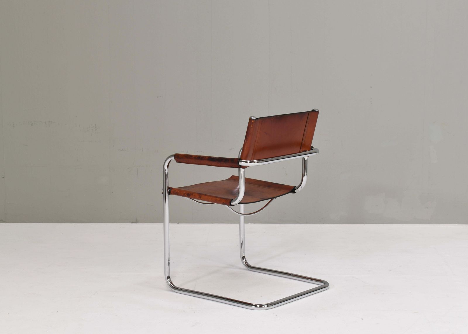 photo furniture Mart Stam S34 Dining Armchair In Cognac Saddle Leather, 1970s