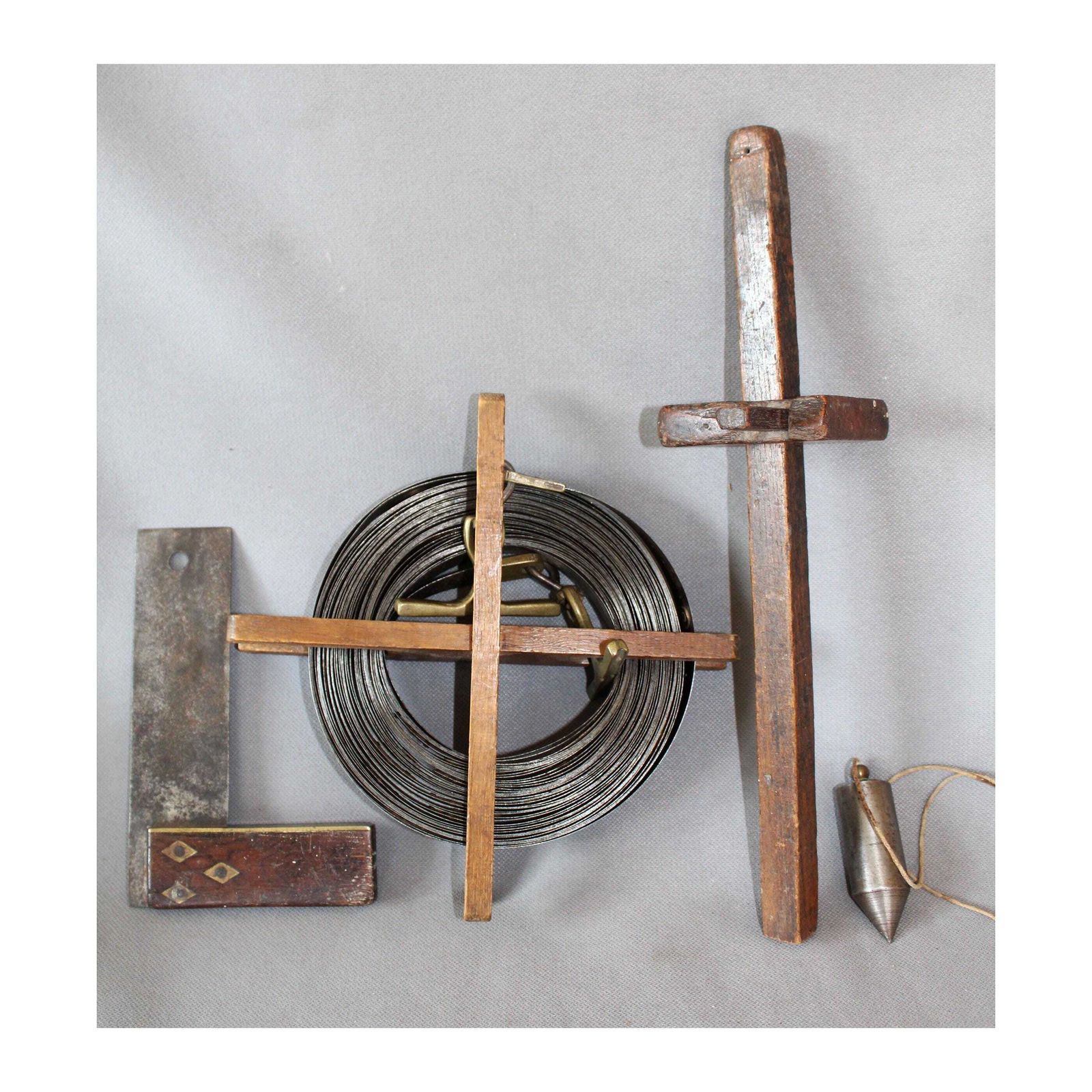 Set Of Four Antique Wood Tools, Surveyor Coiled Steel Tape Measure With Brass, A Scribe Marking Gauge, Square With Inlay, Metal Plumb Bob,