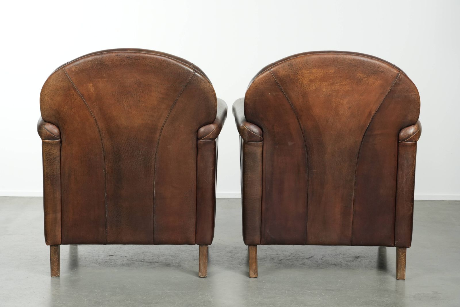 Timeless, Luxurious, And Characterful Set Of Two Sheepskin Designer Armchairs With A Beautiful Patina photo for sale