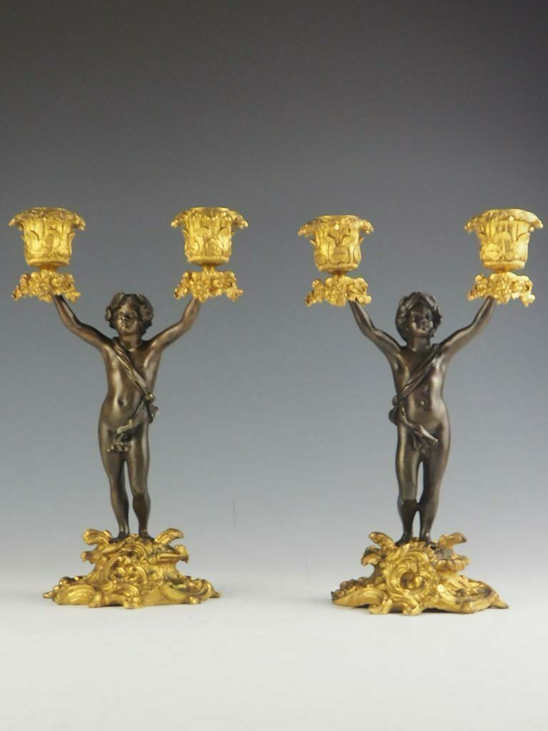 Pair Of 19th Century Bronze And Ormolu Twin Light Cherub Candelabra