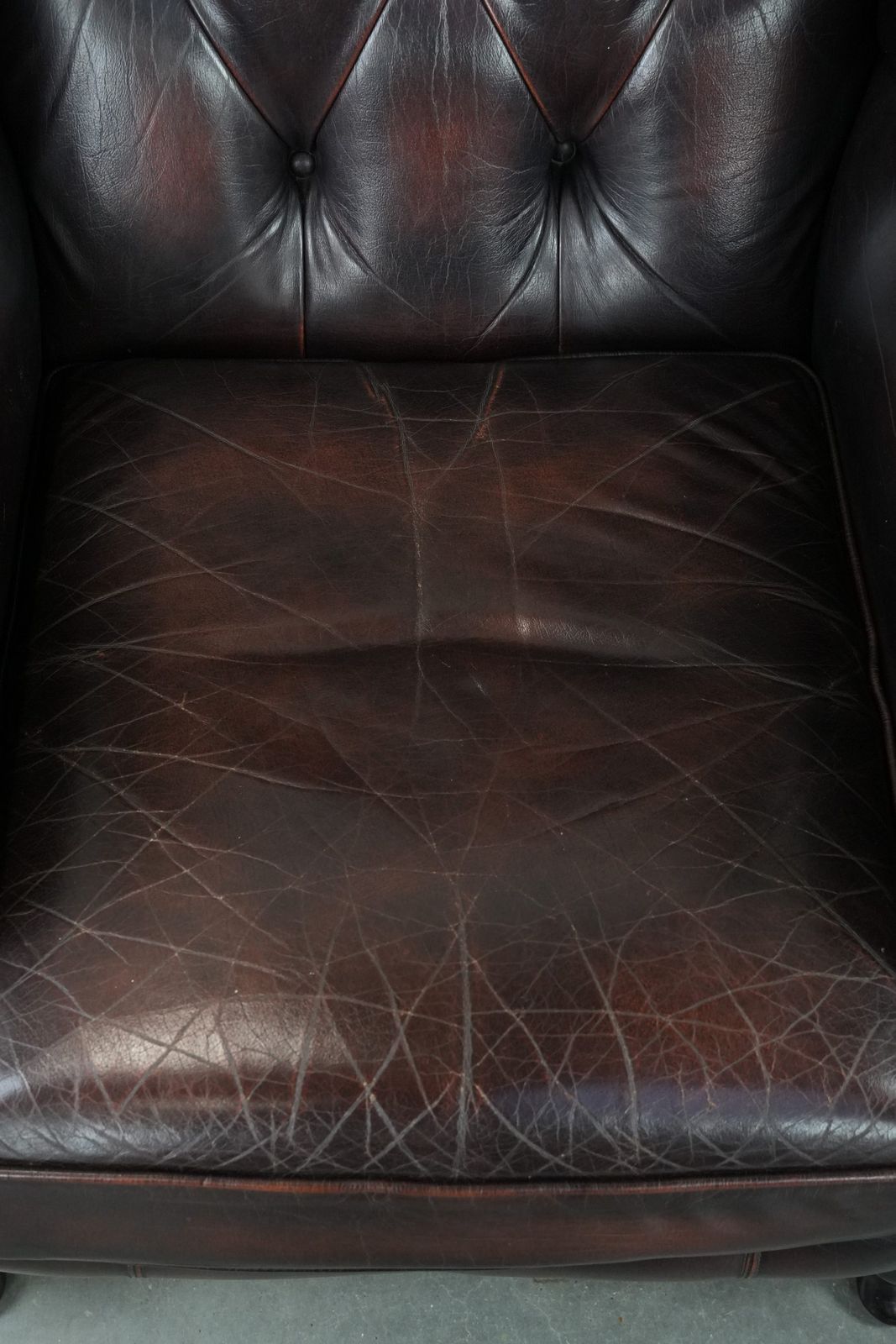 Beautiful, Luxurious, And Comfortable Brown Cowhide Chesterfield Wing Armchair In A Classic English Style. photo vinterior