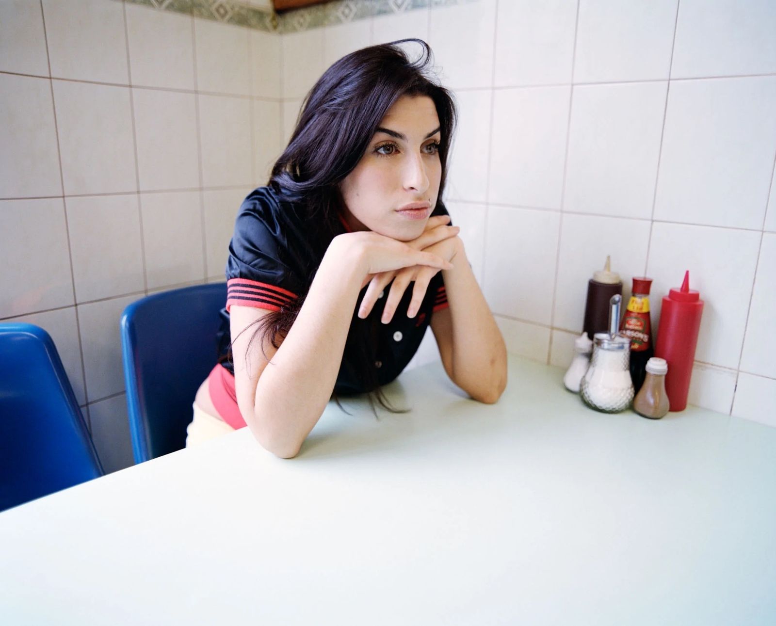 Jake Chessum 'Amy Winehouse Kentish Town Cafe' Signed Limited Edition Print Framed In Black photo furniture