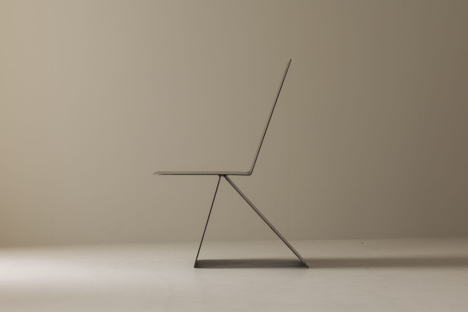Striking Modernist Metal Chair From The 1980s, Executed In Folded Sheet Steel.
