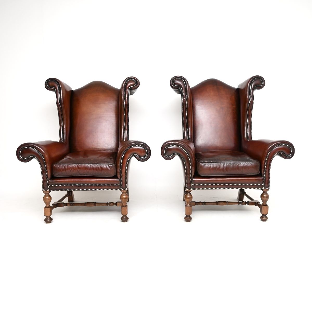 Pair Of Antique Leather Wing Back Armchairs photo for sale