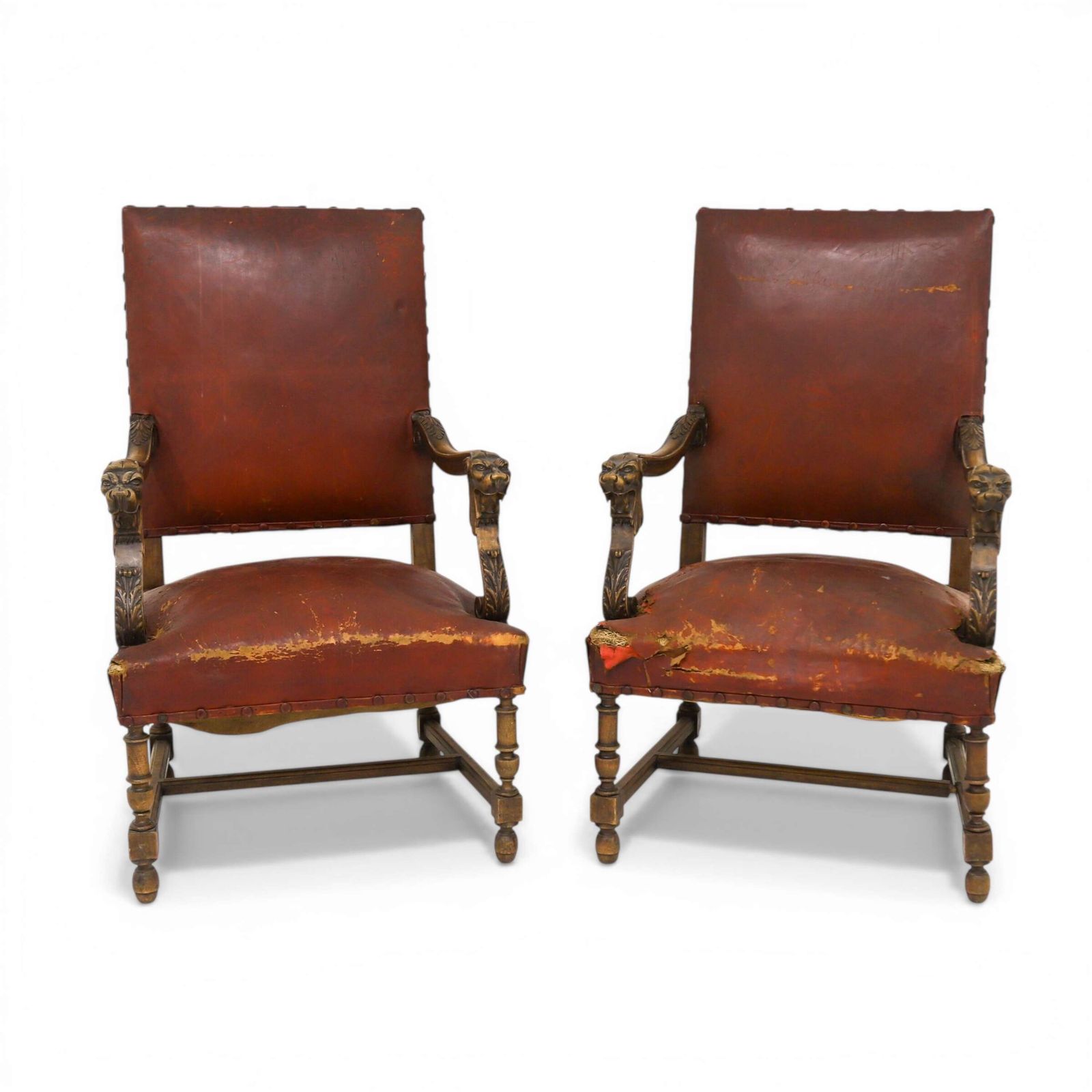 Pair Of French Louis XIV Style Mahogany Lion Head Fauteuils With Distressed Leather