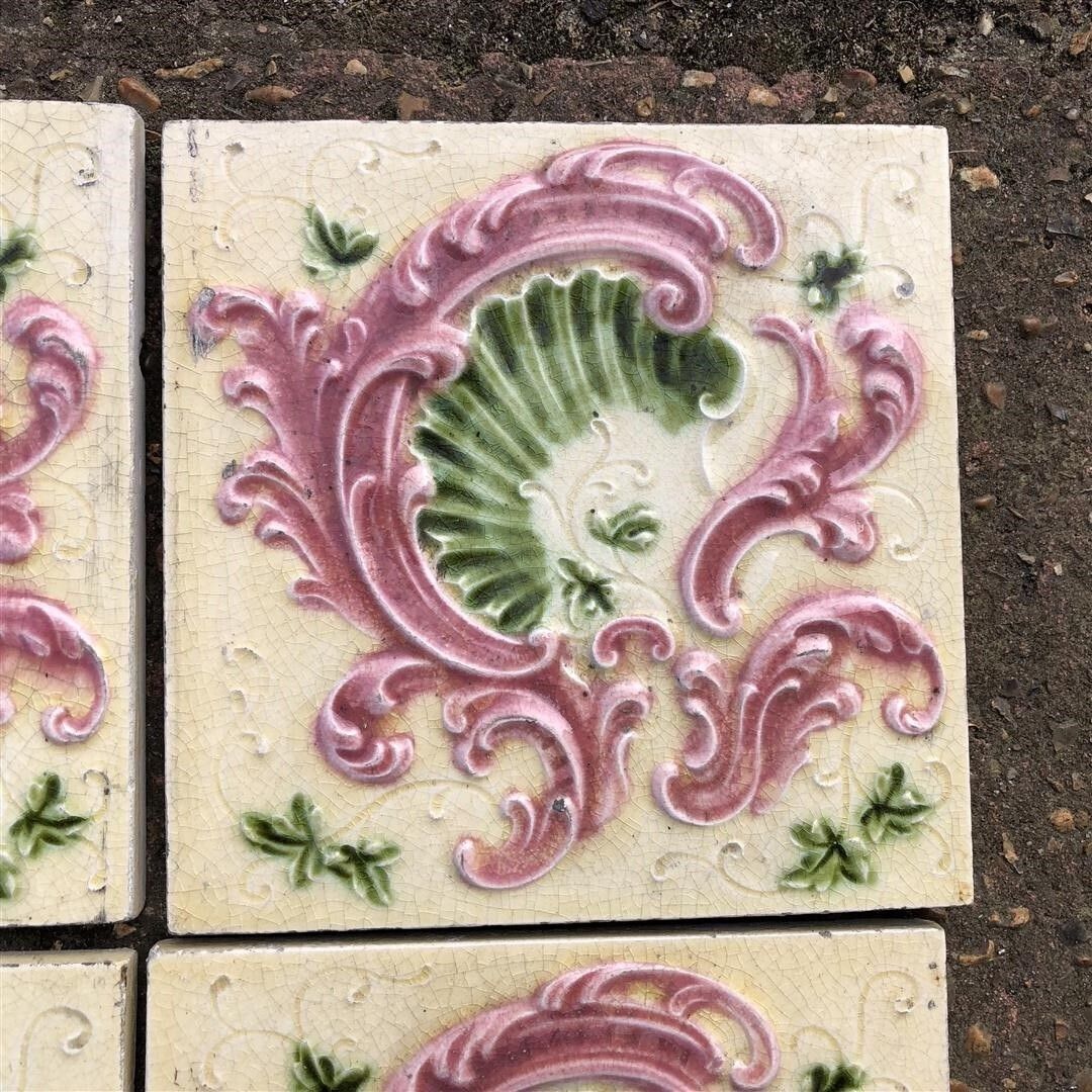 photo furniture Six Antique Ceramic Fireplace Tiles Cream Glaze With Pink And Green Embossed Shell Design