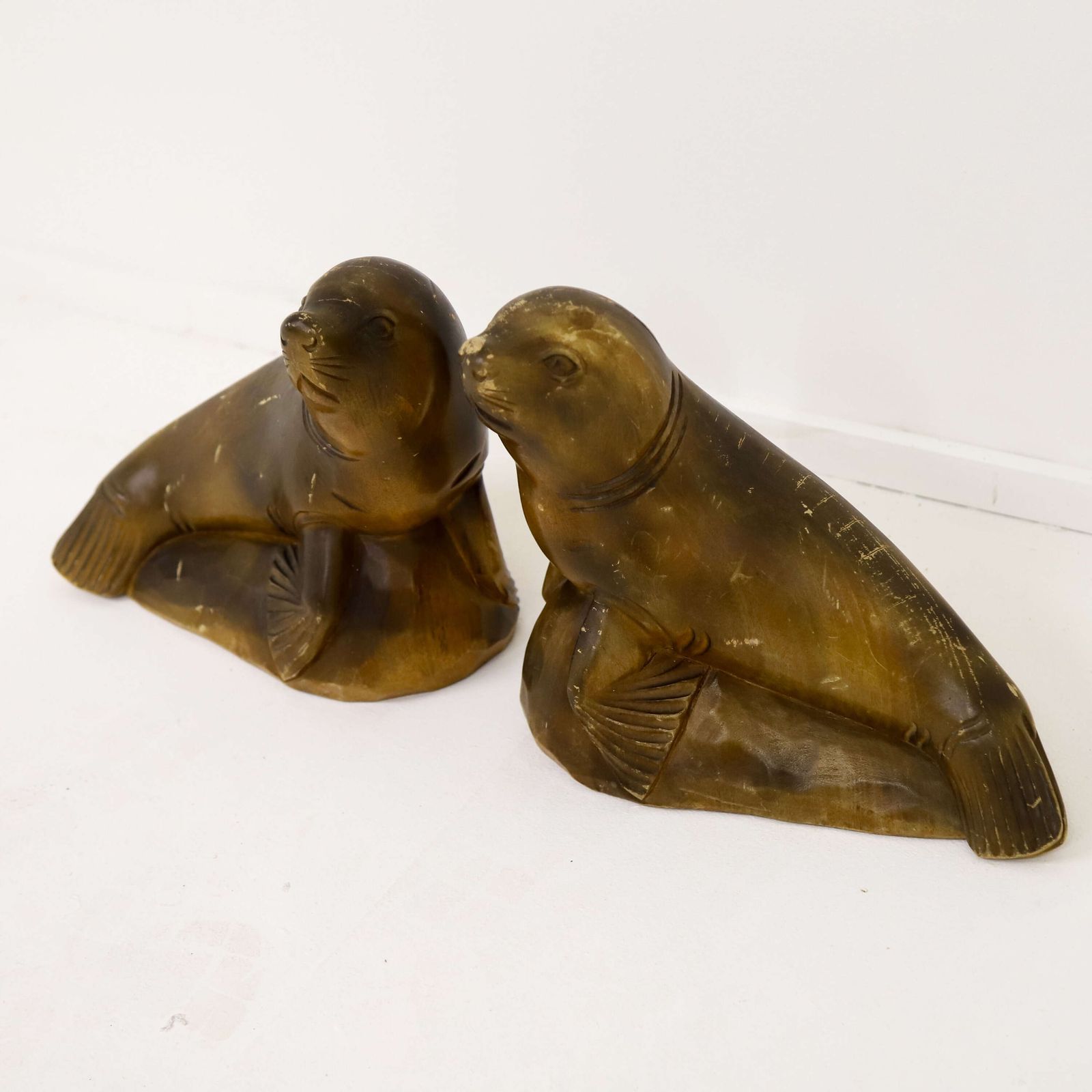 photo furniture Highly Decorative Pair Of Mid‑Century Seal Sculptures   1950s Carved Figures