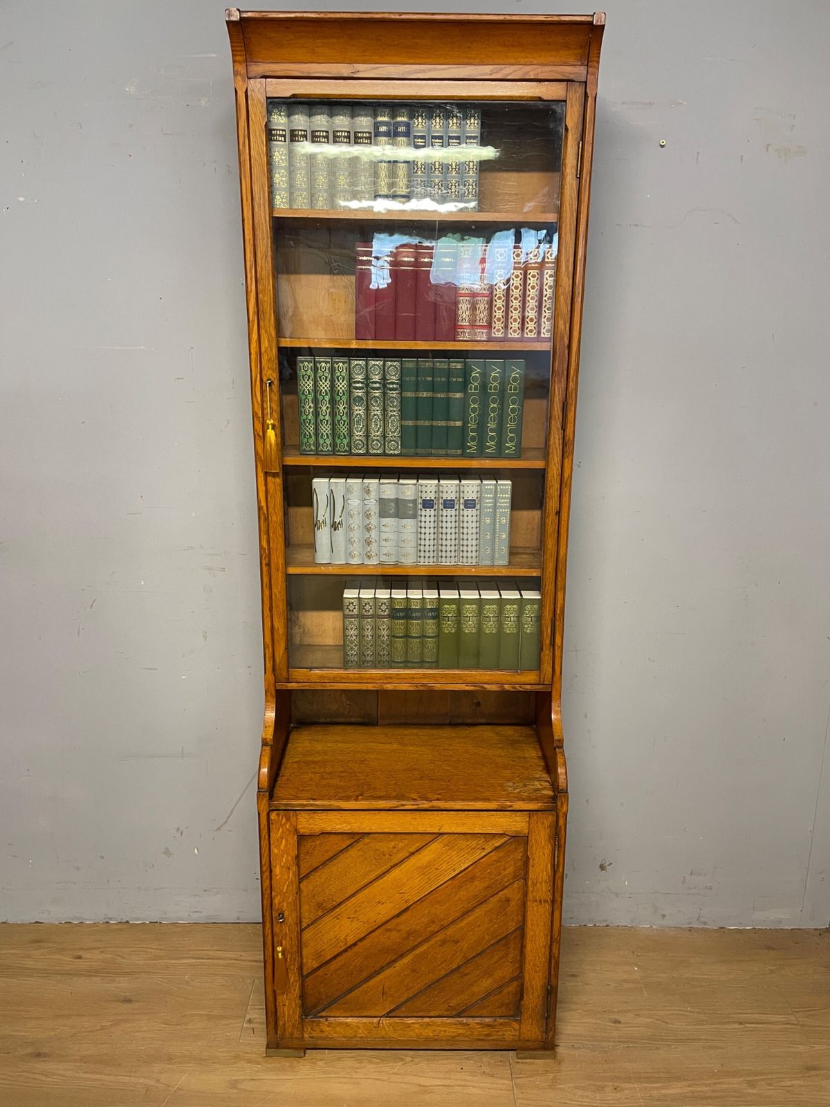Arts And Crafts Golden Oak Slim Bookcase Over Cupboard photo furniture