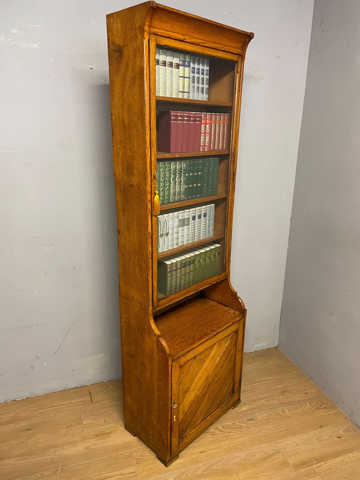 photo furniture Arts And Crafts Golden Oak Slim Bookcase Over Cupboard