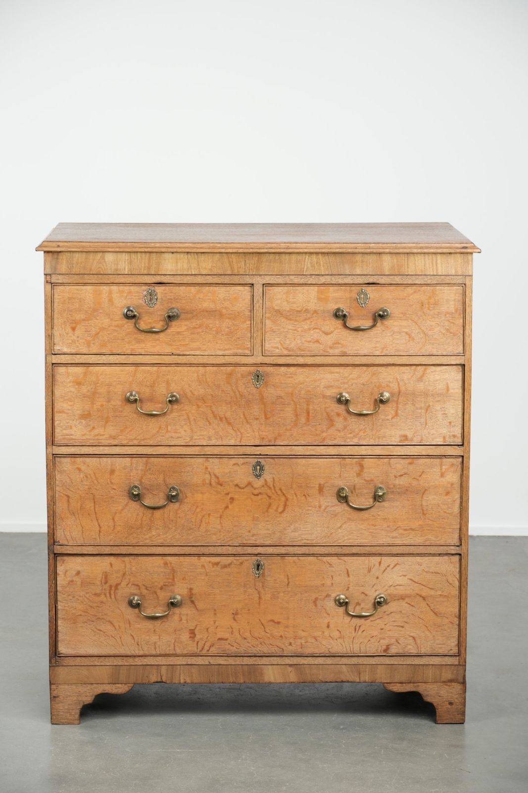 Large Antique English Blonde Oak Chest Of Drawers From The 18th Century With Gold Colored Elements photo furniture