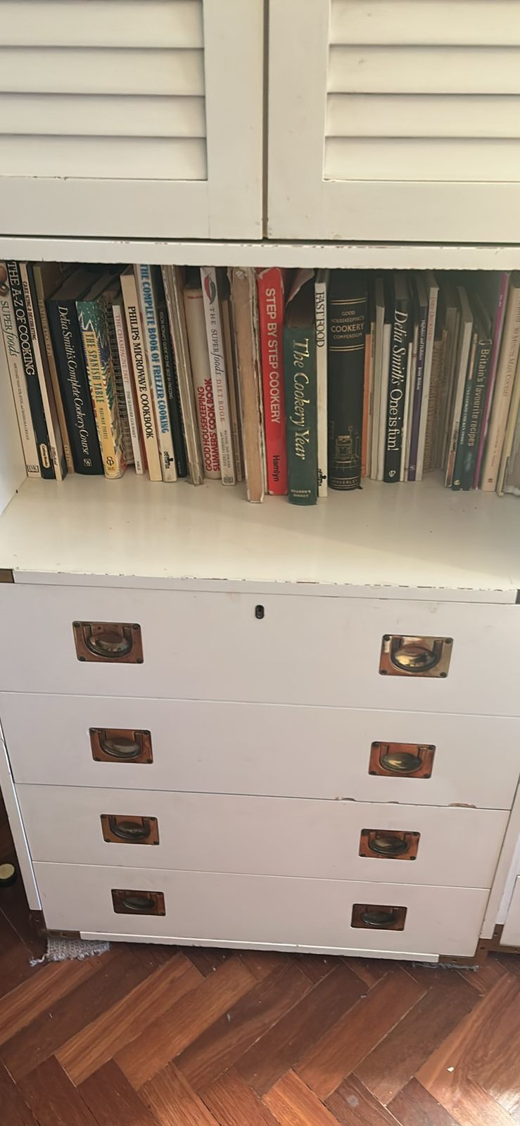 A Mid Century Modular White Shelving Unit In A Campaign Style With Solid Brass Features photo Furniture