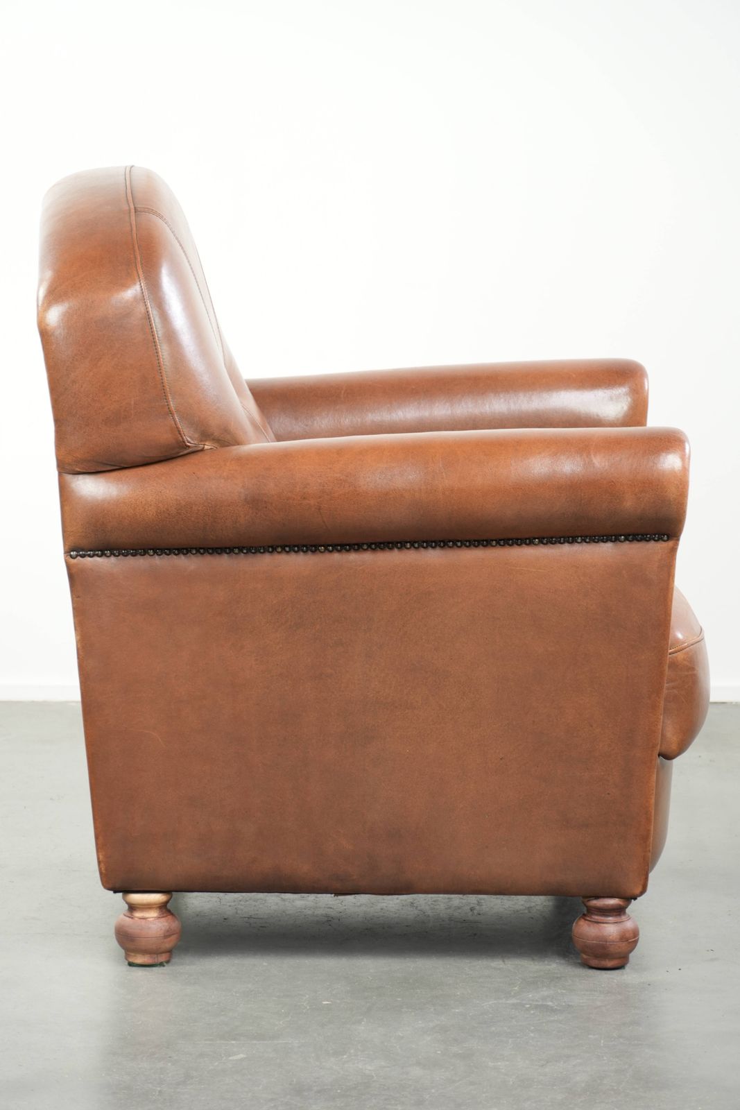 Beautiful, Stately Armchair In Good Condition, Made Of Sheepskin With A Refined Finish Featuring Decorative Nails. photo for sale
