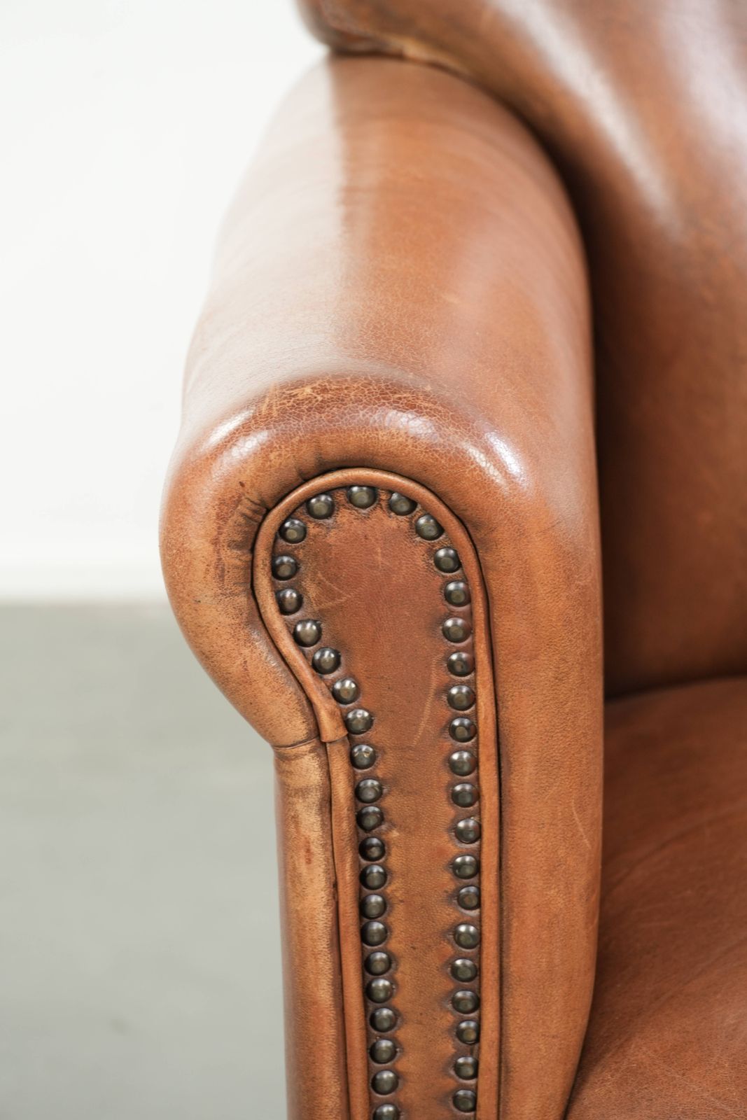 photo for sale Beautiful, Stately Armchair In Good Condition, Made Of Sheepskin With A Refined Finish Featuring Decorative Nails.