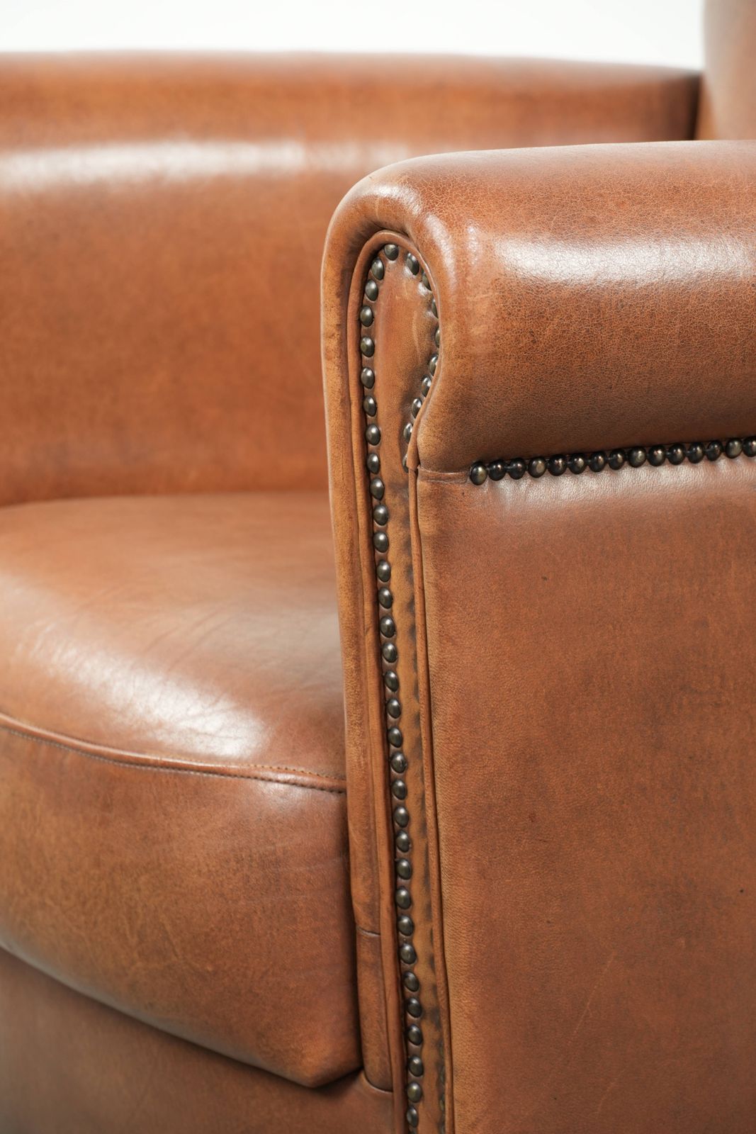 1053.0 Beautiful, Stately Armchair In Good Condition, Made Of Sheepskin With A Refined Finish Featuring Decorative Nails. photo