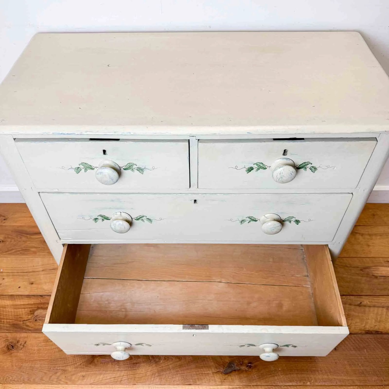 325.0 Painted Antique Pine Chest Of Drawers With Leaf Decoration photo