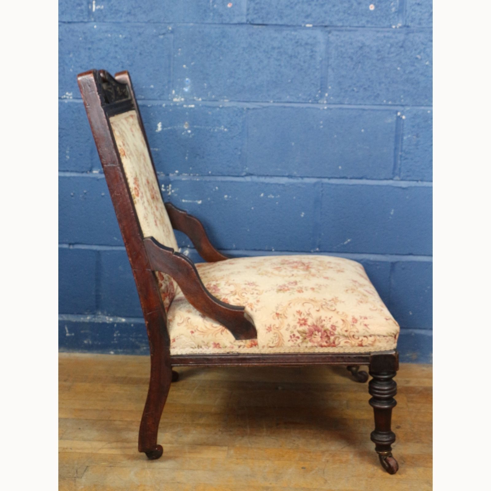 A Victorian Carved Walnut Framed Fireside Chair Raised On Turned Supports photo furniture