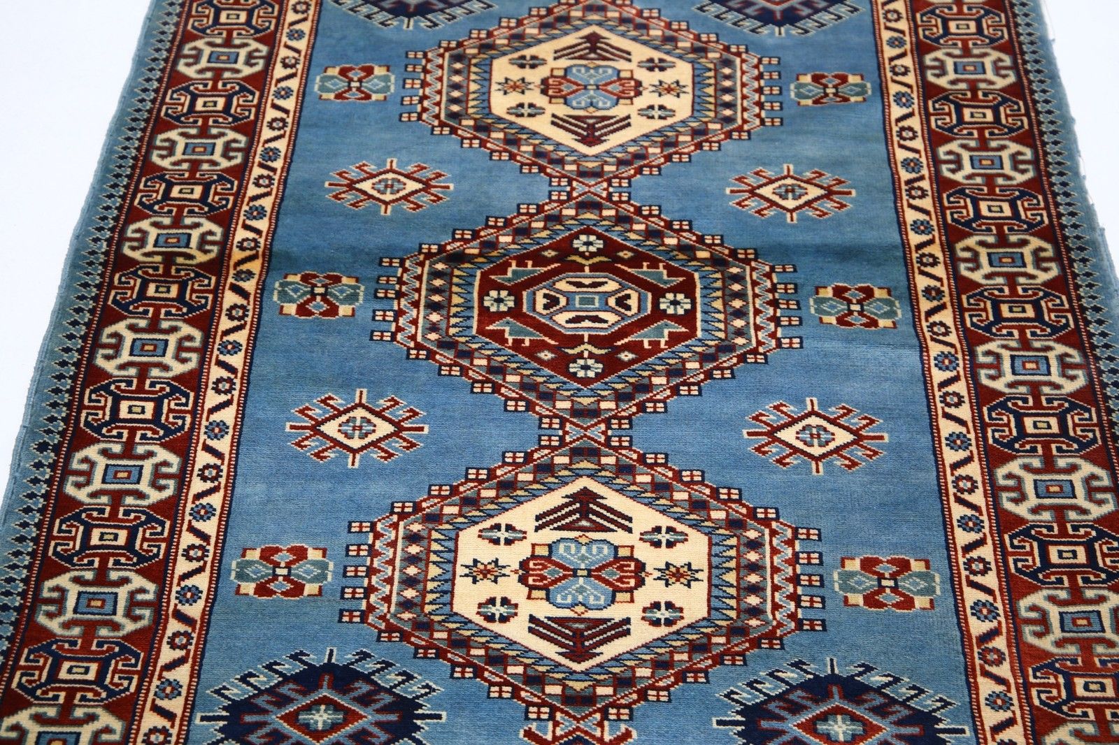 Tapis d'accent en laine noué à la main, bleu clair, rouge et ivoire, de style tribal, 97 x 145 cm photo 752.0