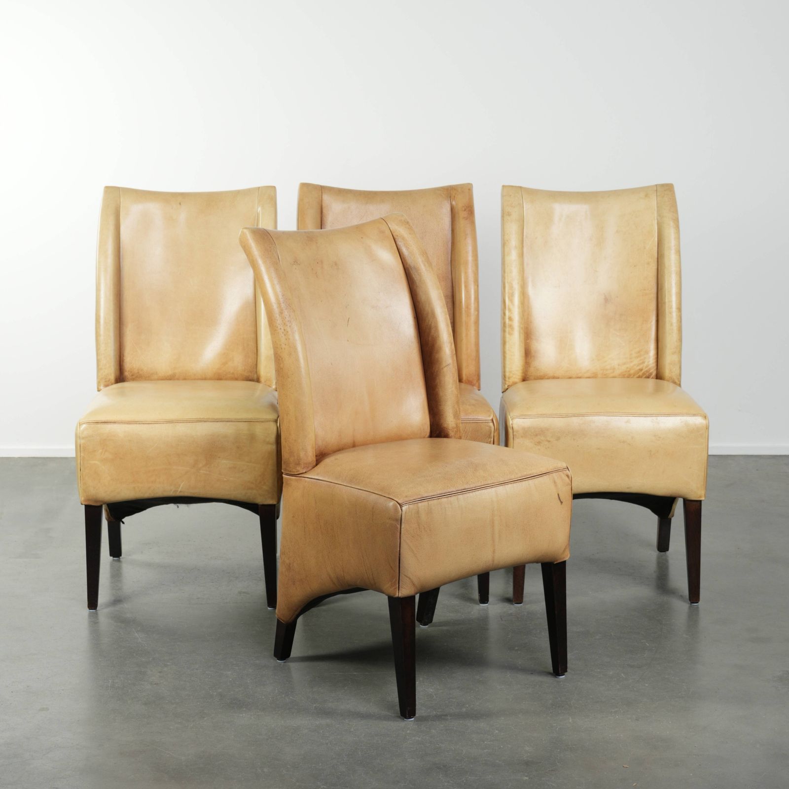 Luxury Set Of Four Cowhide Leather Dining Chairs With A Beautiful Light Color, Comfortable Seat, And A High Back