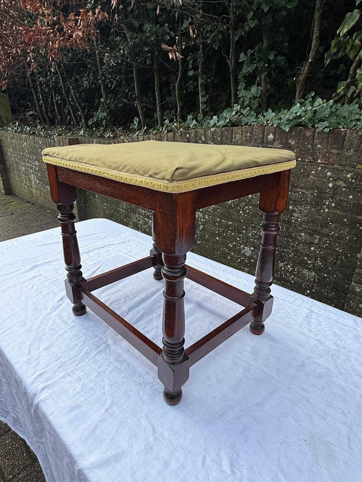 Vintage Upholstered Mahogany Footstool Or Occasional, Vanity Stool With Turned Legs And Green Velvet Like Seat photo for sale