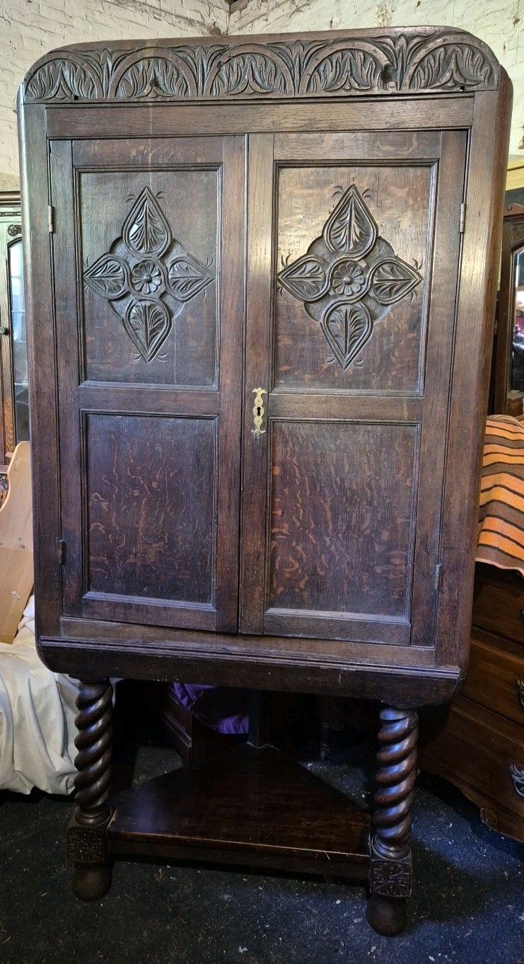 1920's Jacobean Style Large Carved Oak Corner Cabinet On Barley Twist Legs