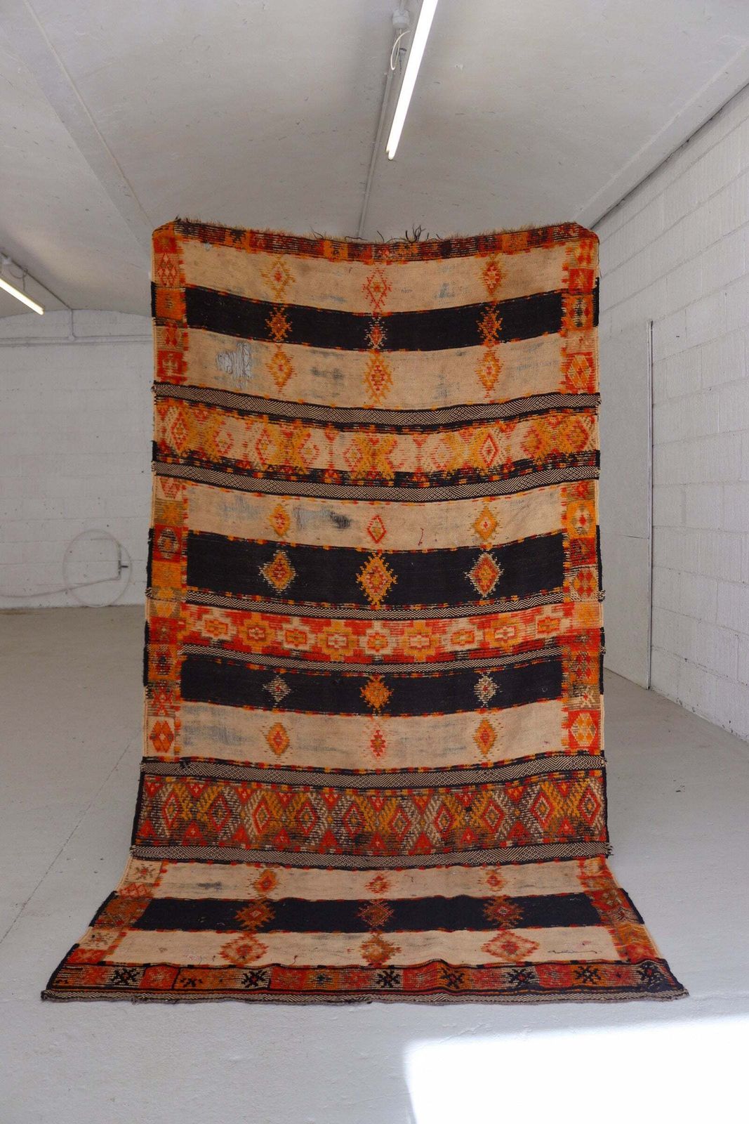 Antique Hanbel Rug | Charcoal & Terracotta With Diamond Motifs photo furniture