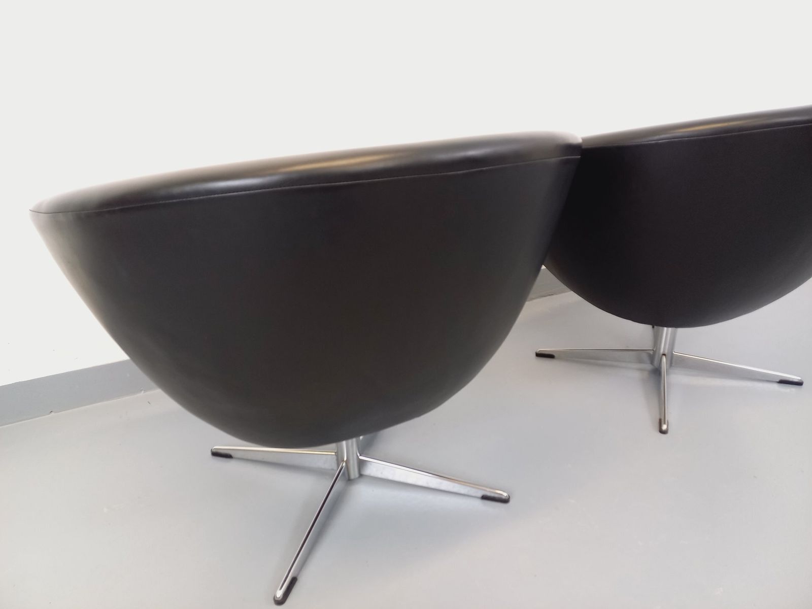 photo buy 2 Swivel Armchairs In Black Imitation Leather And Chrome