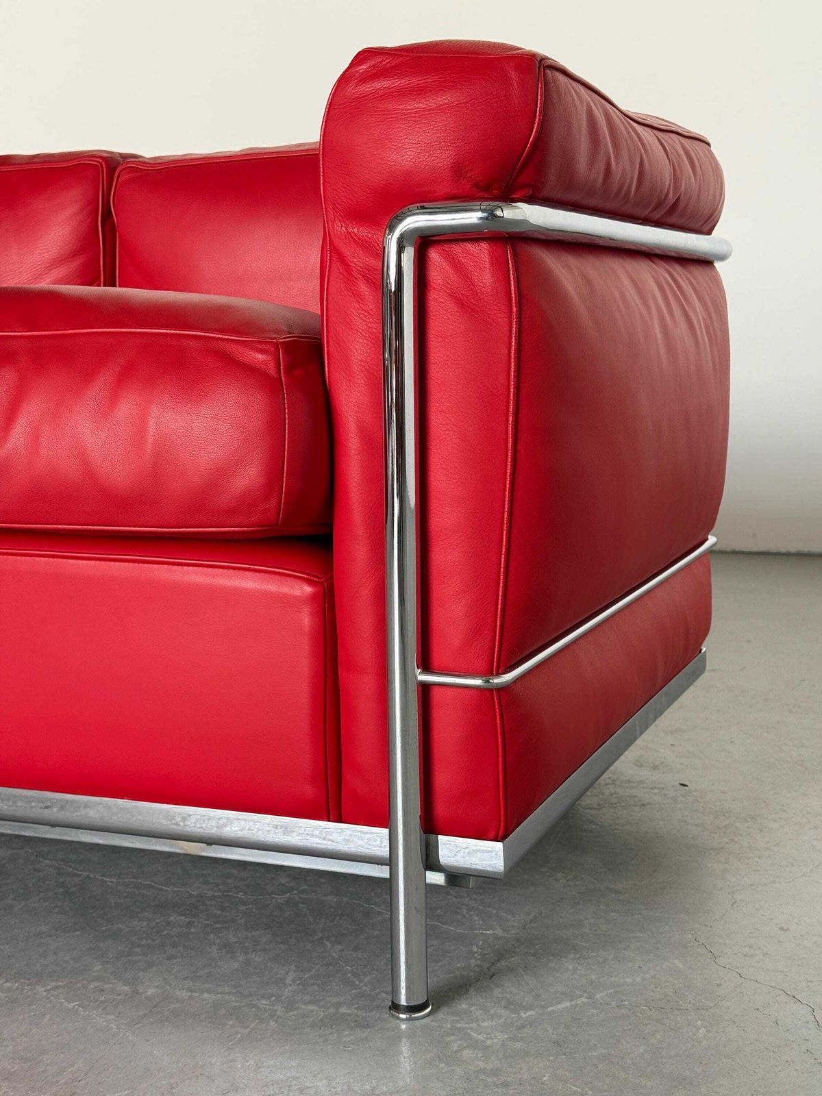 photo for sale Iconic ‘Lc2’ Two Seater Sofa By Le Corbusier, Charlotte Perriand And Pierre Jeanneret For Cassina, Red Leather & Chromed Steel