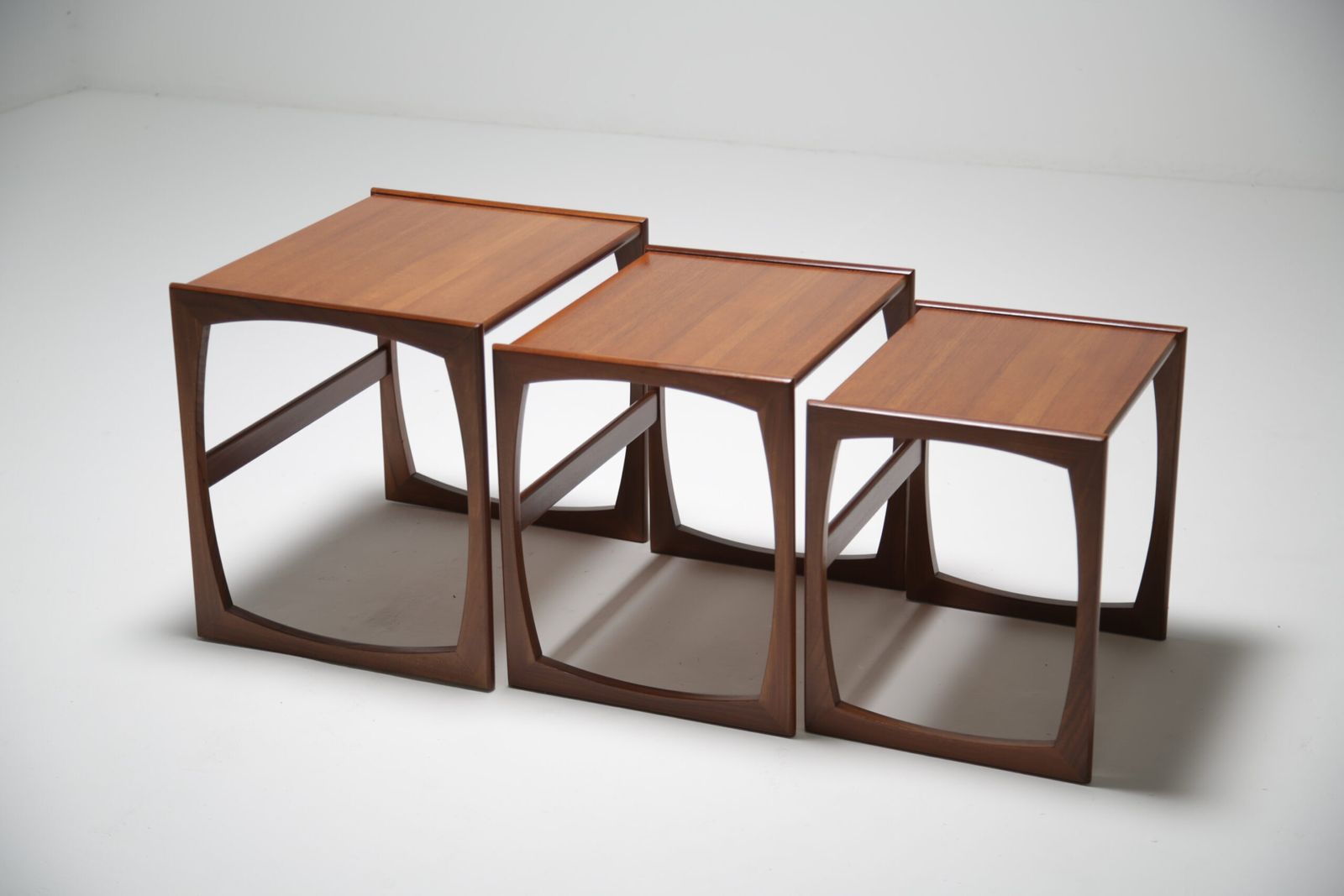 G Plan Quadrille Nest Of Tables: Iconic Teak & Afromosia ‘Sled Leg’ Trio By R. Bennett, Uk, 1960s photo Furniture