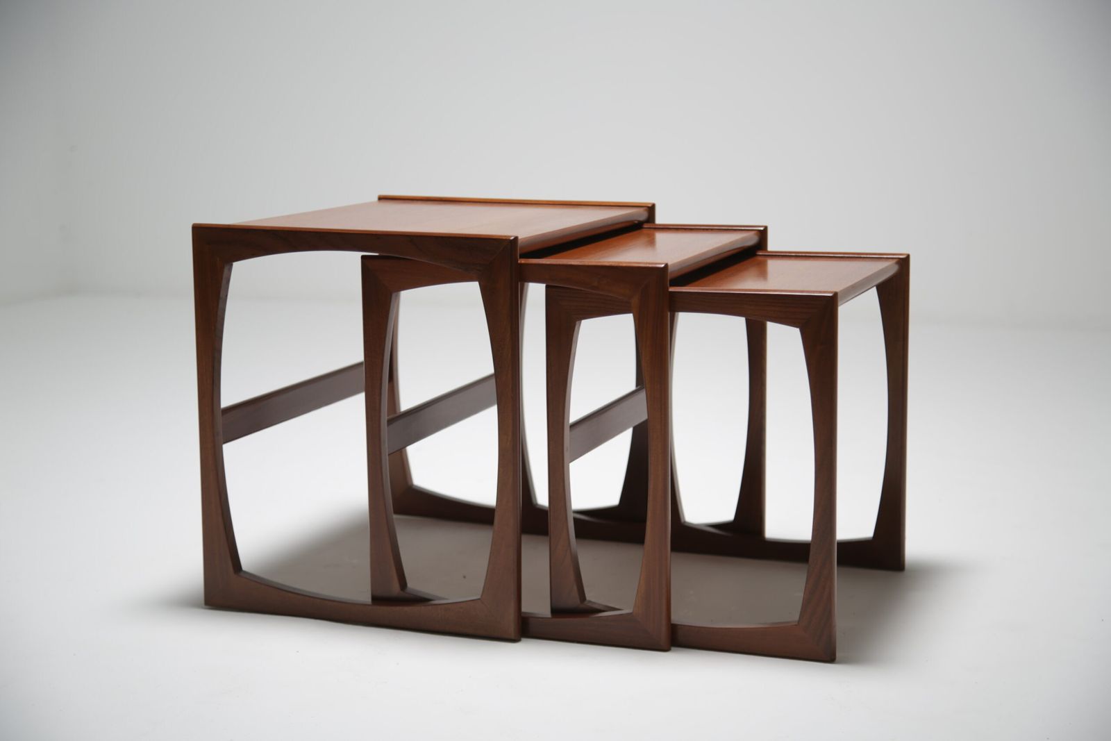 G Plan Quadrille Nest Of Tables: Iconic Teak & Afromosia ‘Sled Leg’ Trio By R. Bennett, Uk, 1960s photo vintage