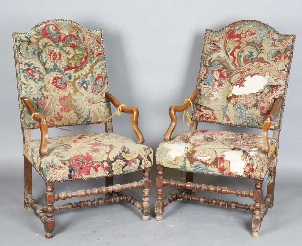 A Pair Of Early 18th Century French Walnut Open Armchairs