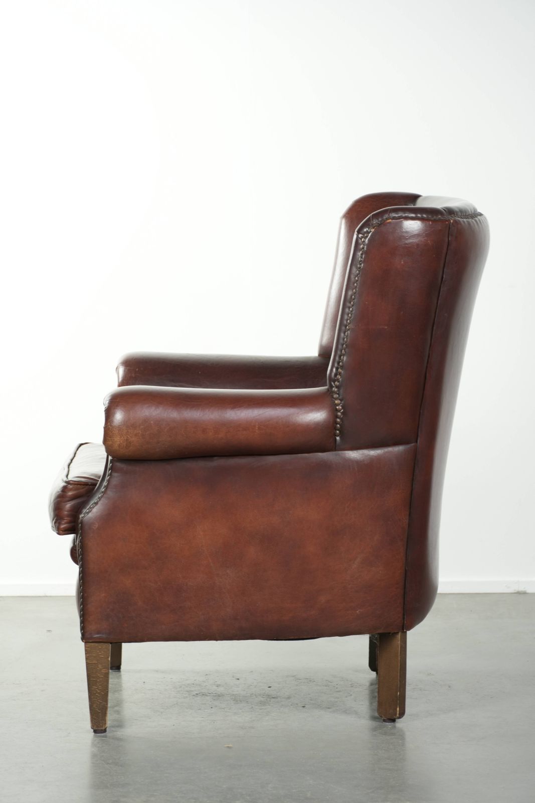 Lovely Vintage Sheepskin Armchair With A High Back In A Beautiful, Subtle Size, Finished With Decorative Nails. photo 809.0