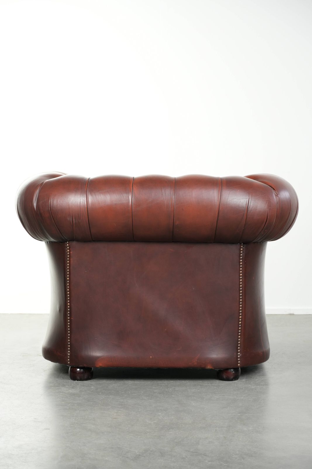 Beautiful Red/Brown Cowhide Chesterfield Armchair In A Classic English Style With A Stunning Appearance. photo Furniture