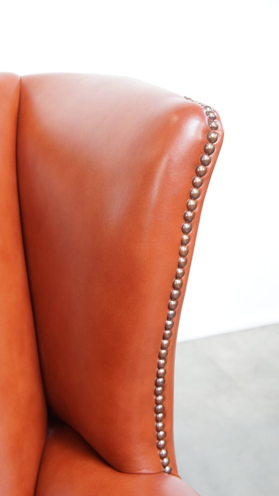 Furniture Elegant And Comfortable Smooth English Cowhide Chesterfield Wing Armchair With Graceful Legs photo