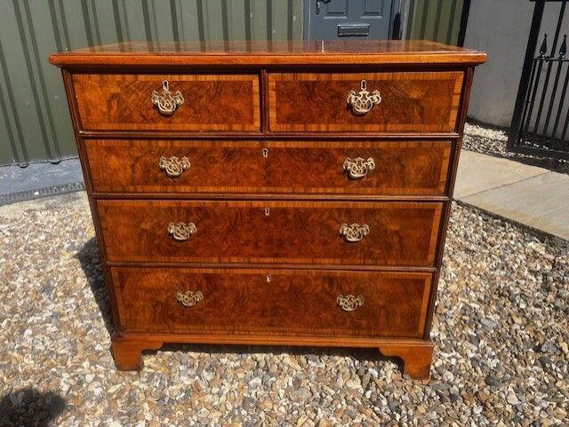 1150.0 A George II Style Burr Walnut Chest Of Drawers. photo