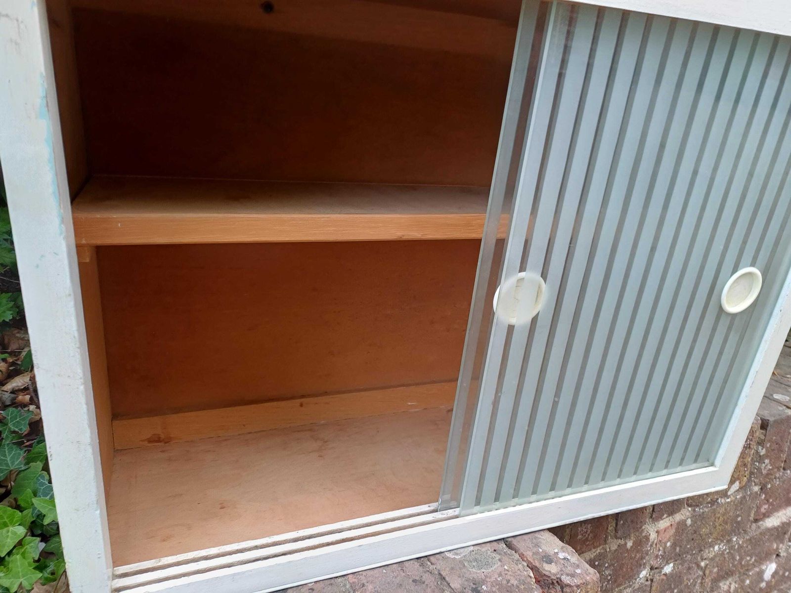 photo vintage 1950s Painted Kitchen Bathroom Wall Cupboard With Sliding Ribbed Glass Doors Mid Century Utility Storage Cabinet