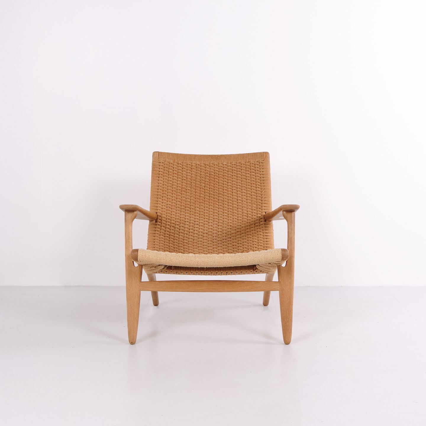 Ch25 Lounge Chair In Patinated Solid Oak And Woven Paper Cord By Hans J. Wegner
