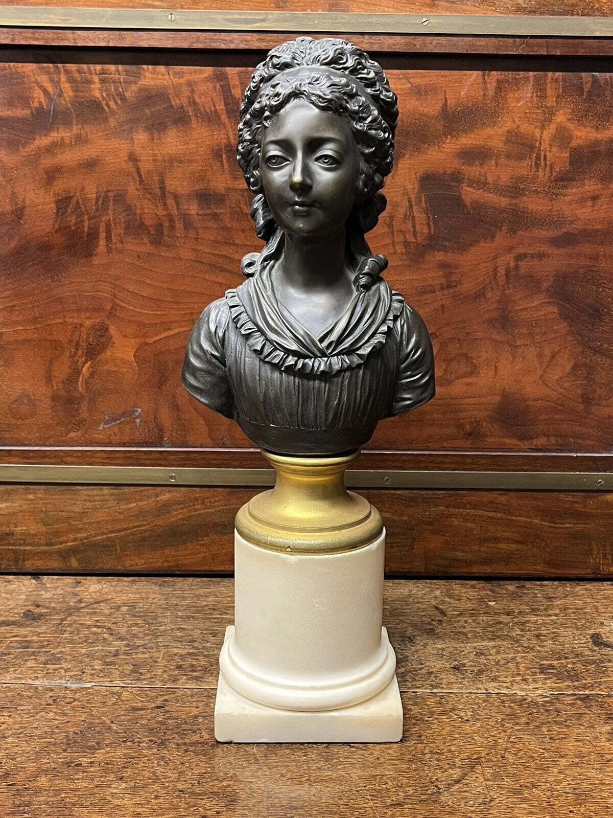Bronze Bust Of A French Woman On A White Marble Column photo vintage