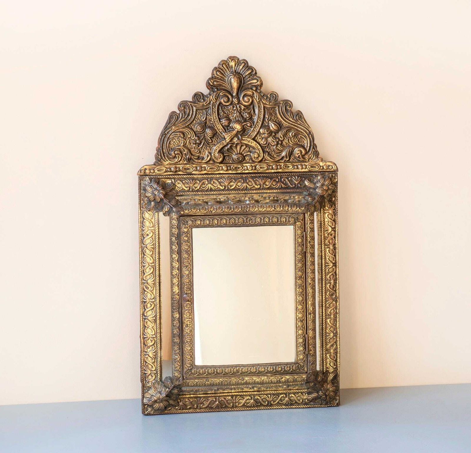 Antique French Brass Mirror With Floral Crest – Ornate Repoussé Vanity Cabinet photo for sale