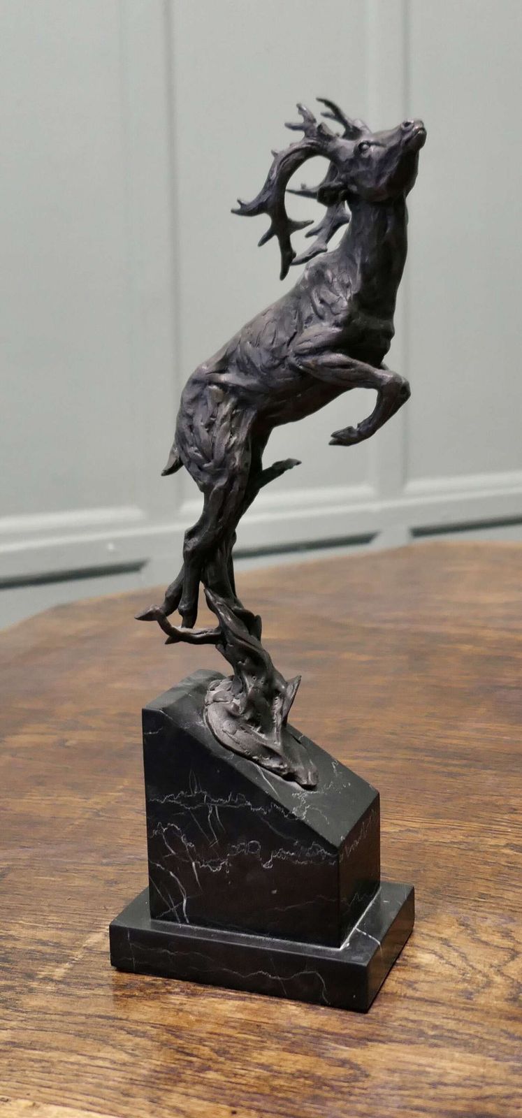 This Is A Signed Bronze Sculpture Of A Deer Jumping, Mounted On A Marble Plinth photo furniture
