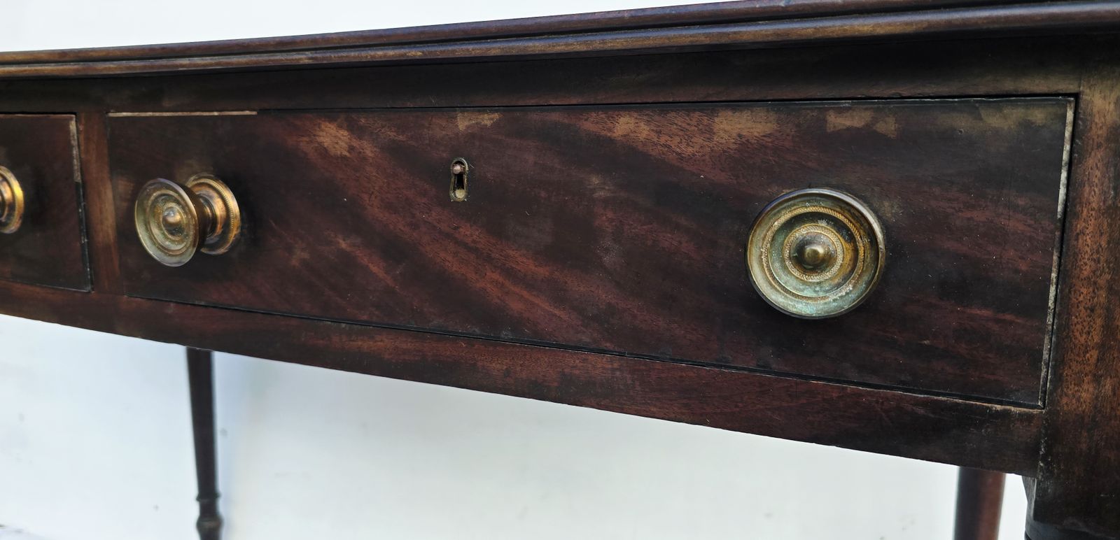Furniture An Antique Regency Mahogany Writing Desk On Castors. photo