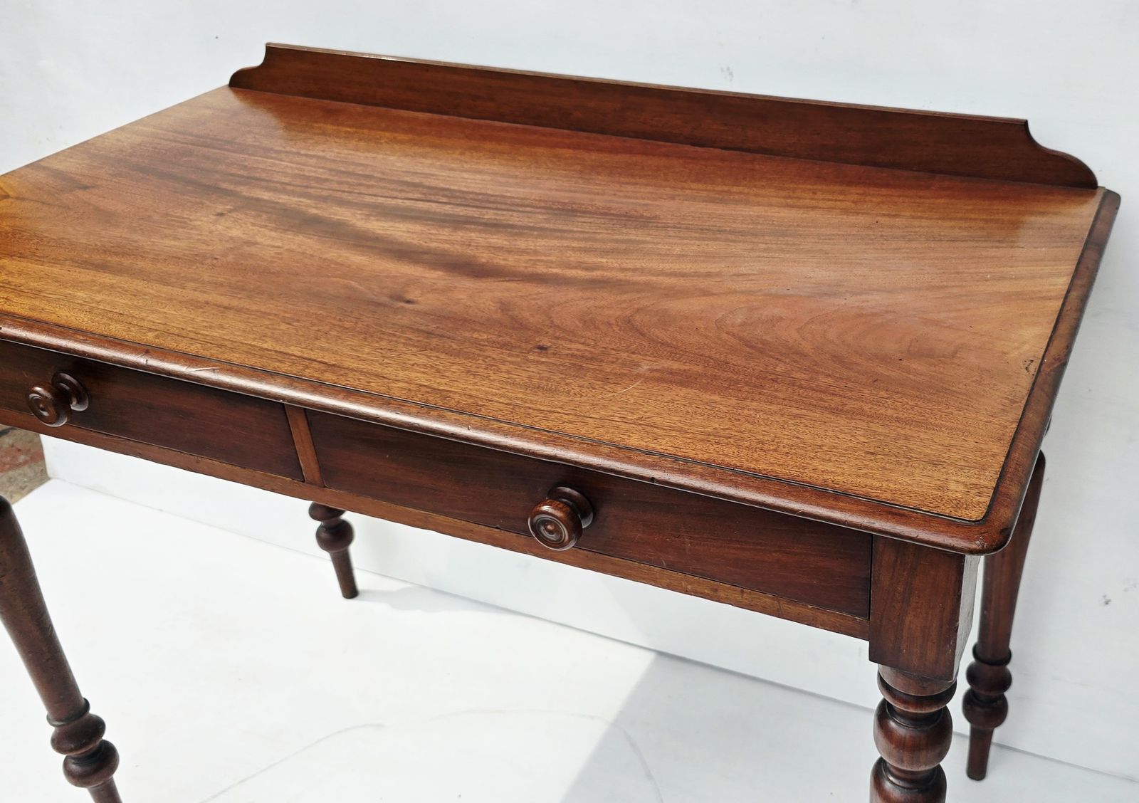 An Antique Mahogany Writing Desk On Turned Legs, 19th C. photo for sale