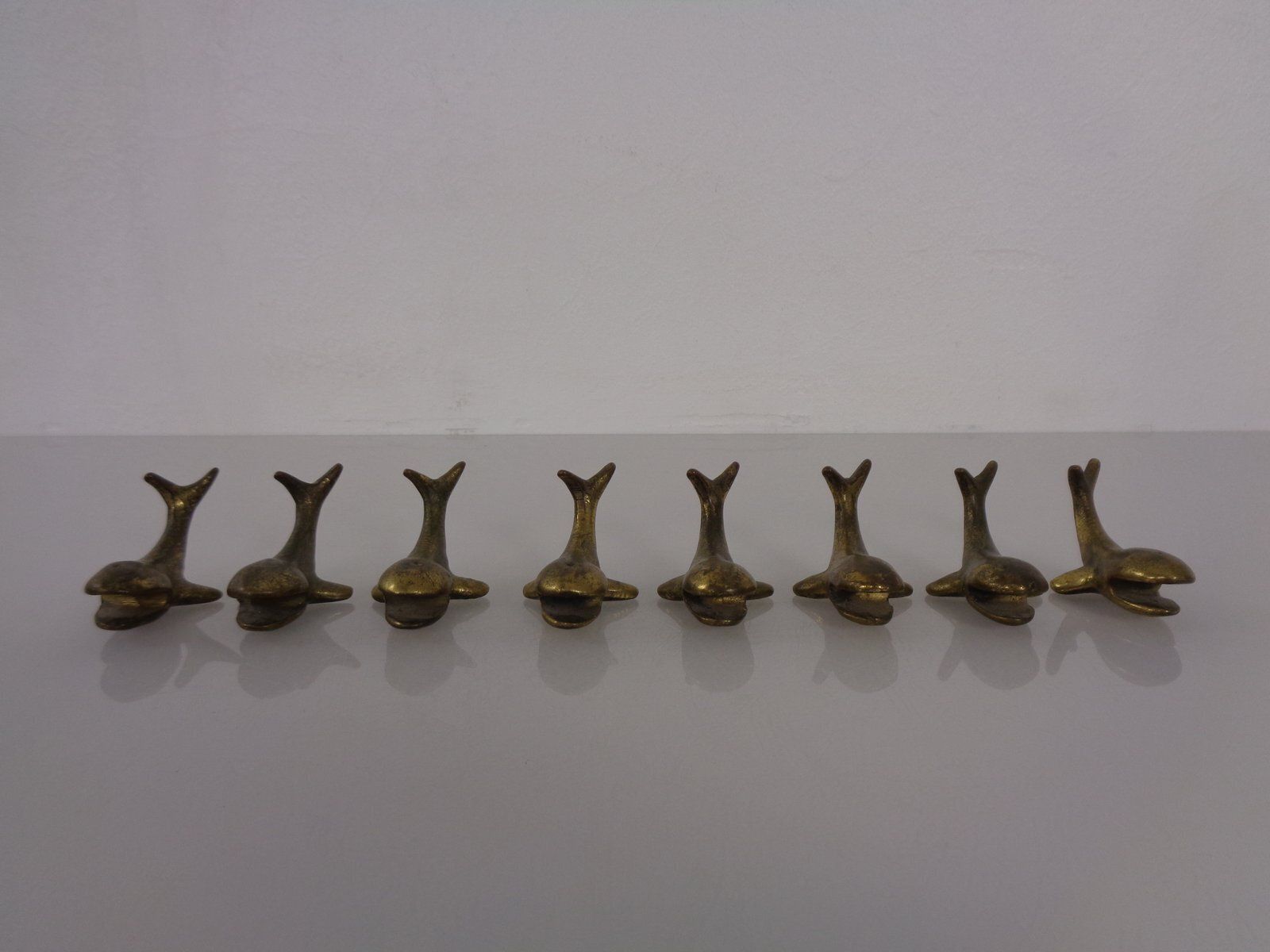 photo furniture Whale Shaped Brass Paperweights Or Knife Rests In The Style Of Walter Bosse, Austria, 1950s, Set Of 4