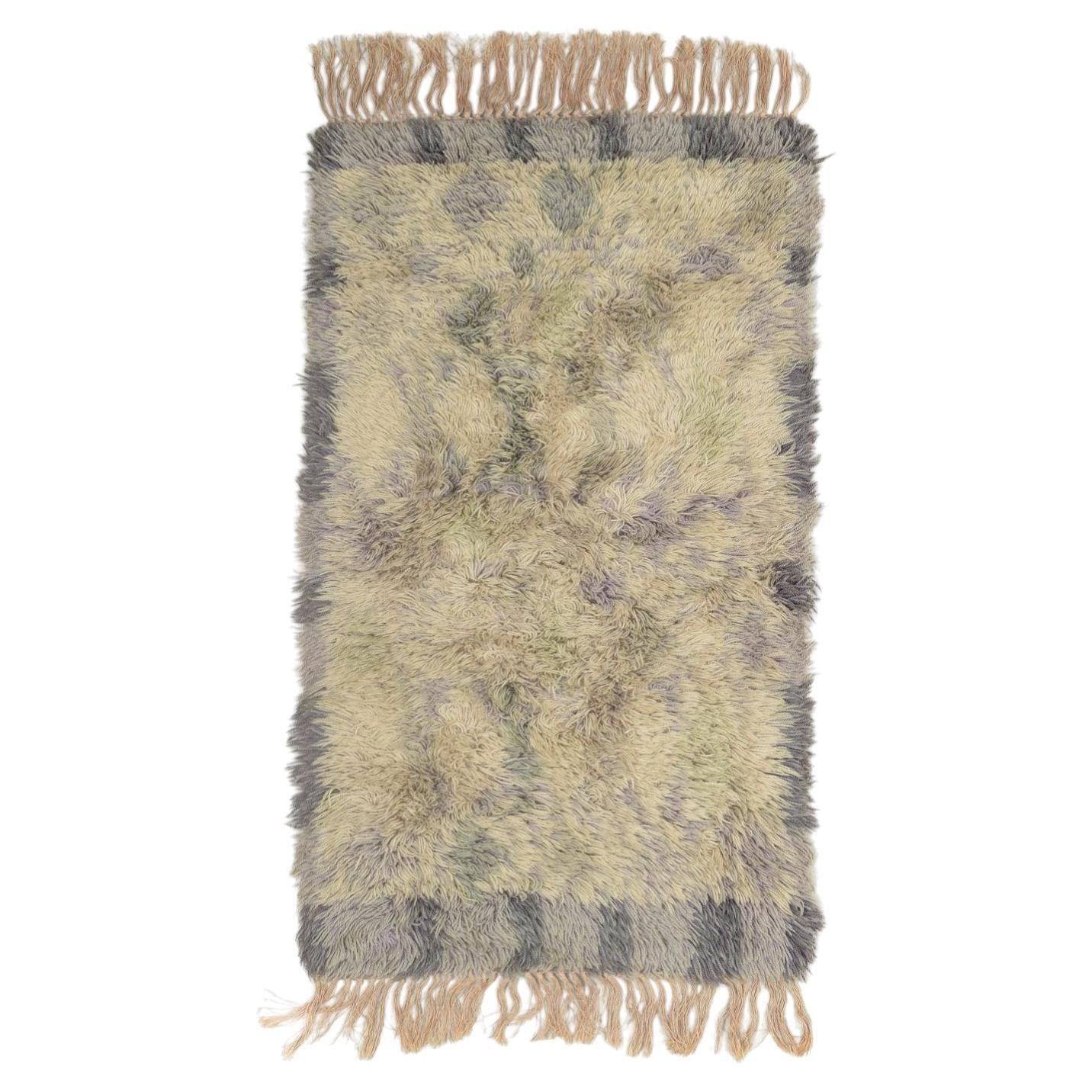 Scandinavisch ontwerp. Rya-tapijt in wol in tinten grijs, beige en lila.