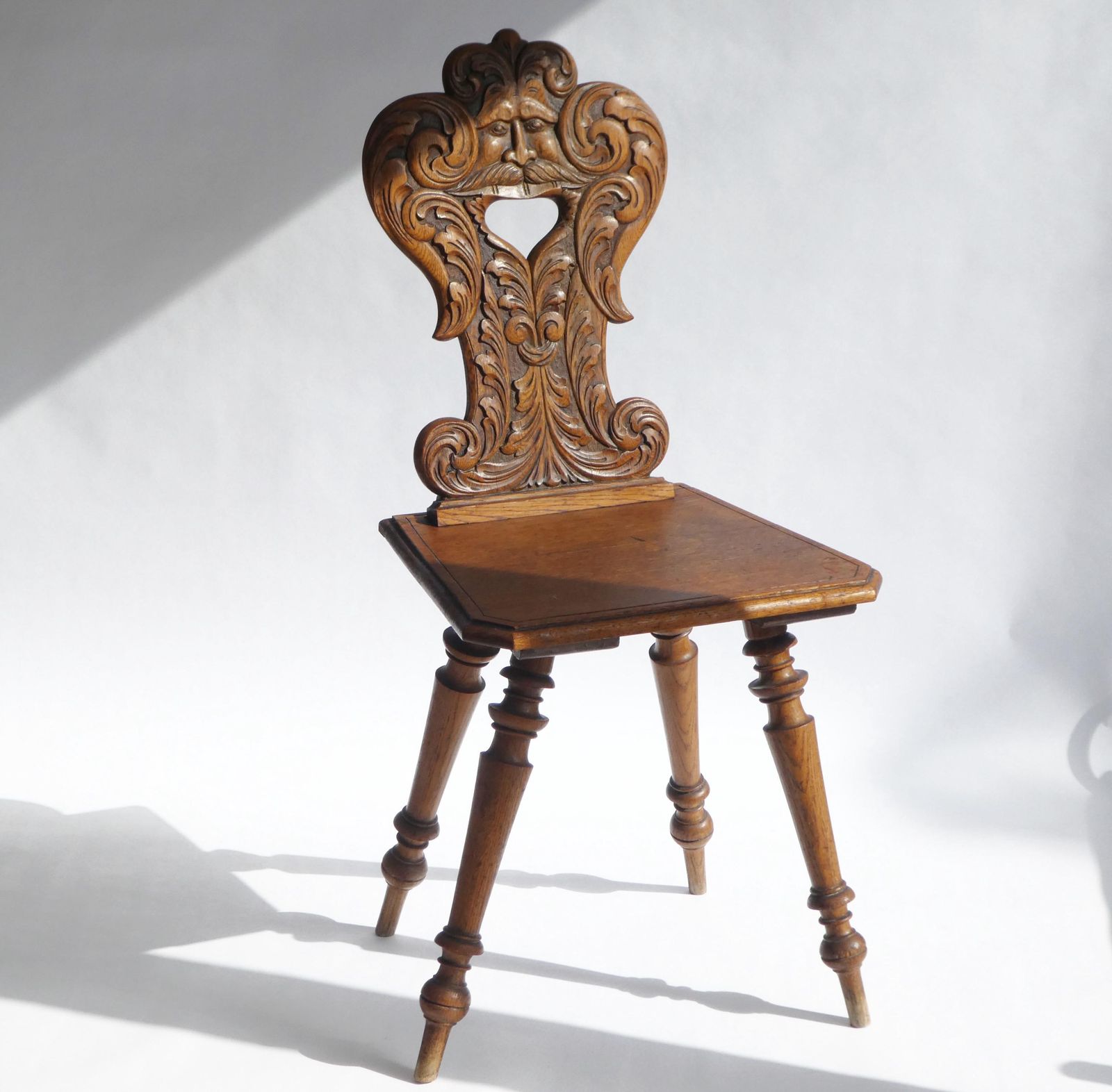 Antique Alpine Oak Folk Art Chair With Carved Face Mask, Brutalist Escabelle Wooden Chair