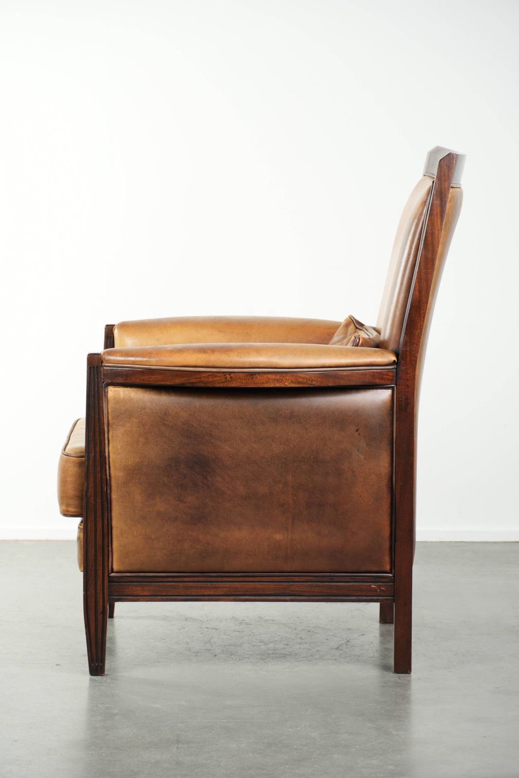 Comfortable Cognac Colored Art Deco Design Armchair Made Of Sheepskin Combined With Wood, With A High Back. photo 834.0