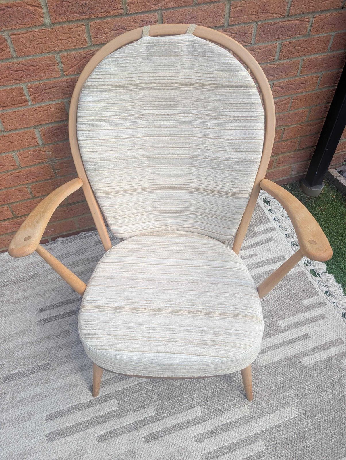 photo furniture Pair Of Ercol 317 Grandfather Armchairs In Blonde Finish With Matching Footstool Including Original Cushions And Covers By Lucian Ercolani.