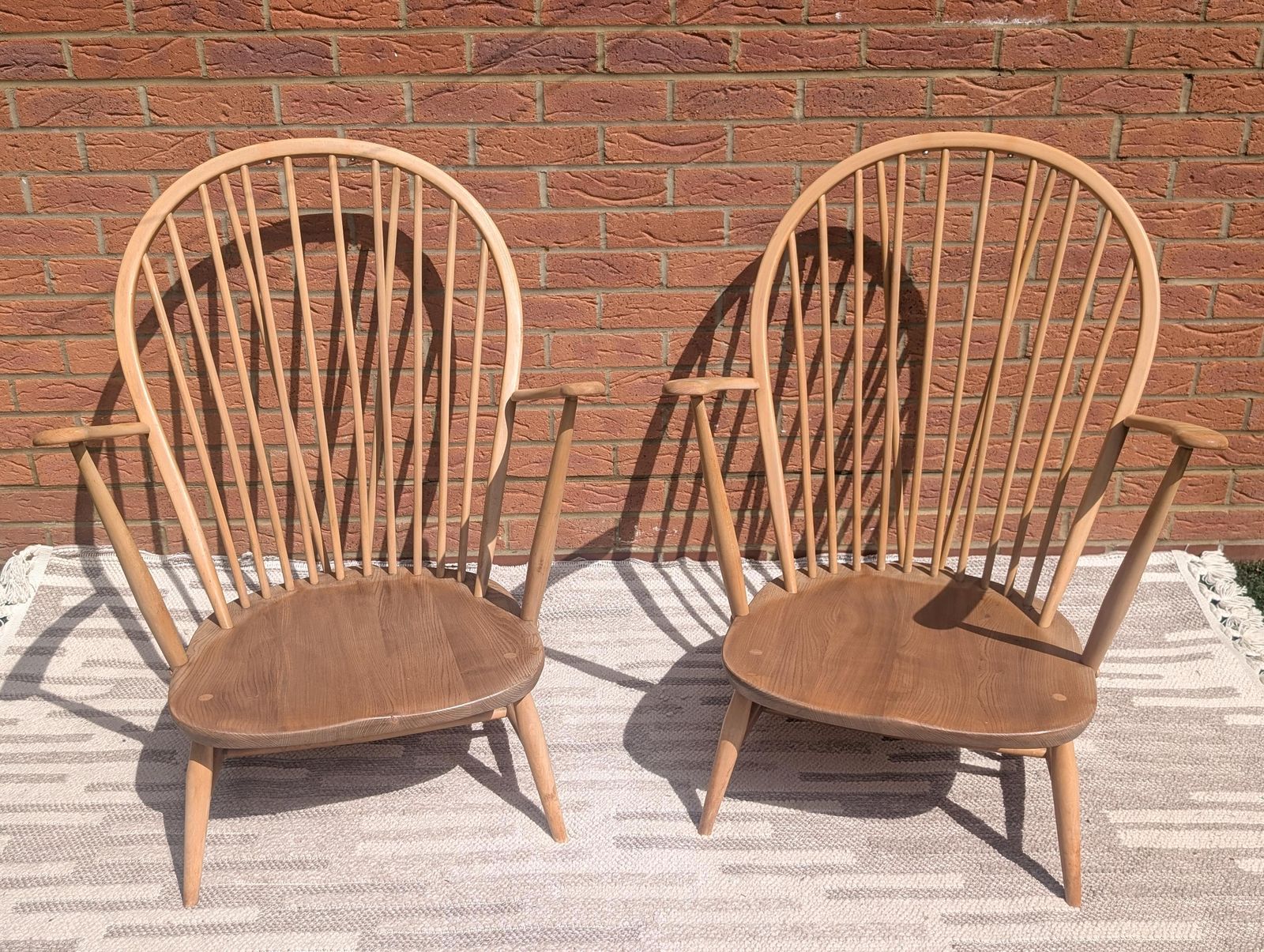 photo buy Pair Of Ercol 317 Grandfather Armchairs In Blonde Finish With Matching Footstool Including Original Cushions And Covers By Lucian Ercolani.