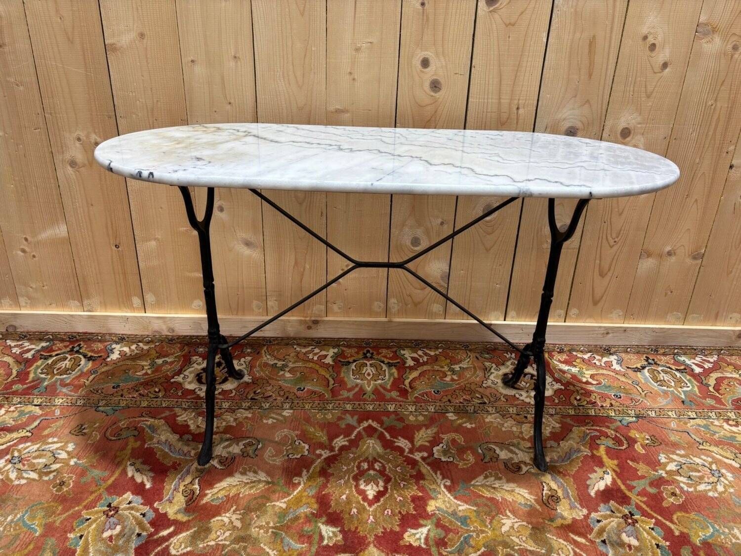 Authentic Bistro Table With White Marble And Cast Iron From The Early 20th Century. photo vintage